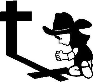 Cowbow on his knees by a Cross