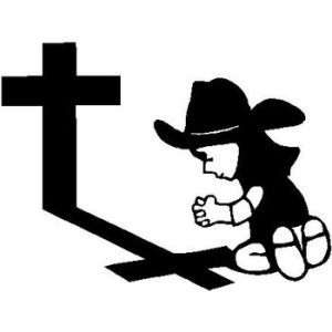 Cowbow on his knees by a Cross